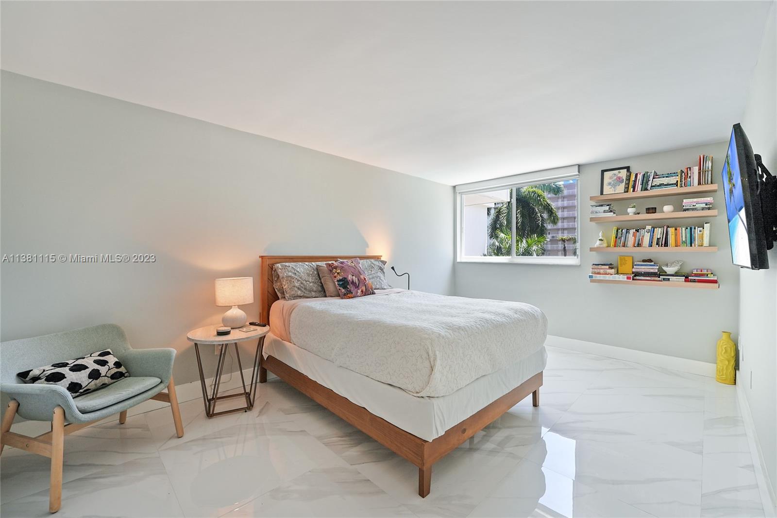 1665 Bay Road, Unit 417 Miami Beach, FL 33139 - Photo 8 of 15 a bedroom with a bed and a couch