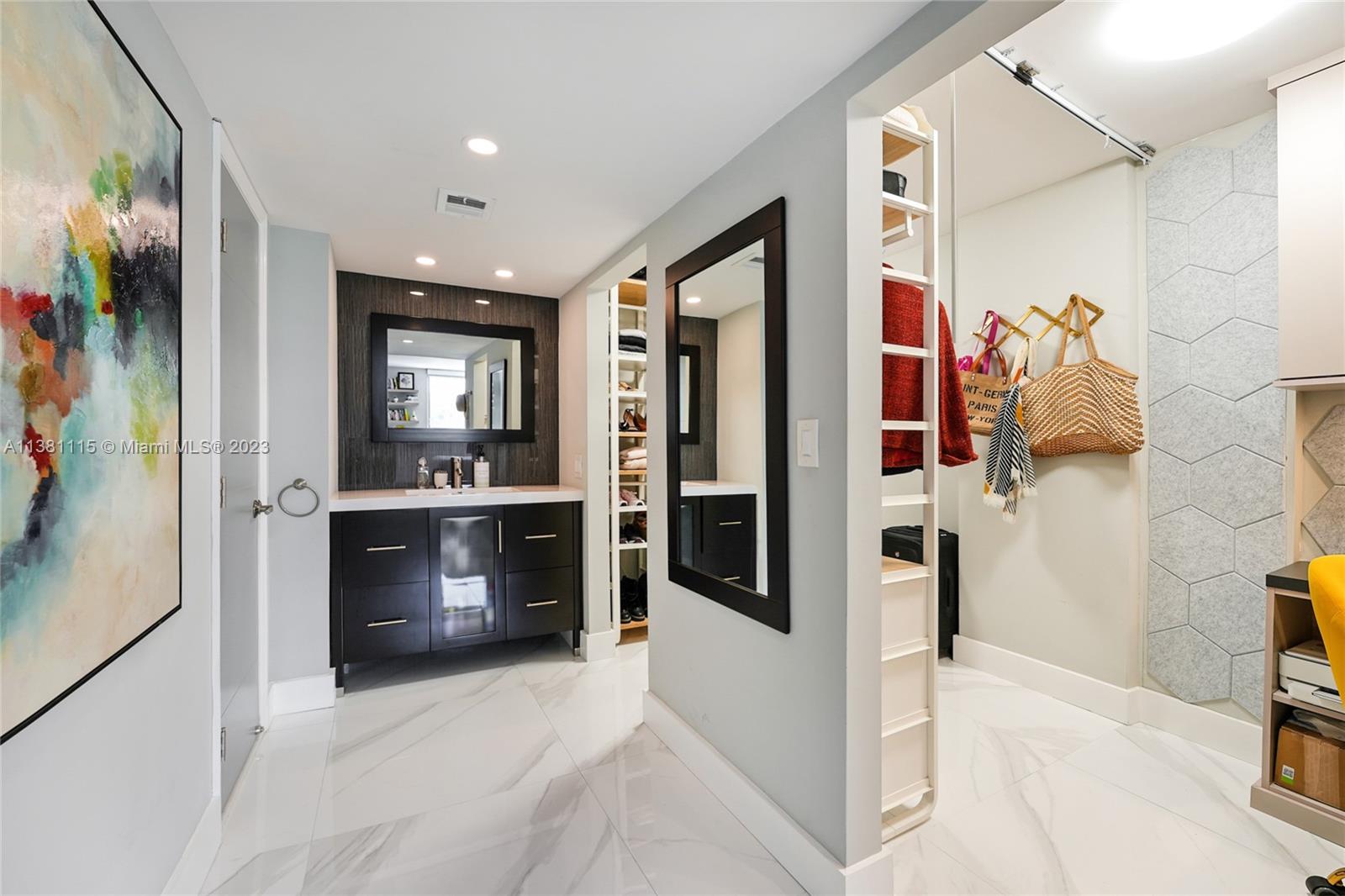 1665 Bay Road, Unit 417 Miami Beach, FL 33139 - Photo 9 of 15 a view of hallway with living room and furniture