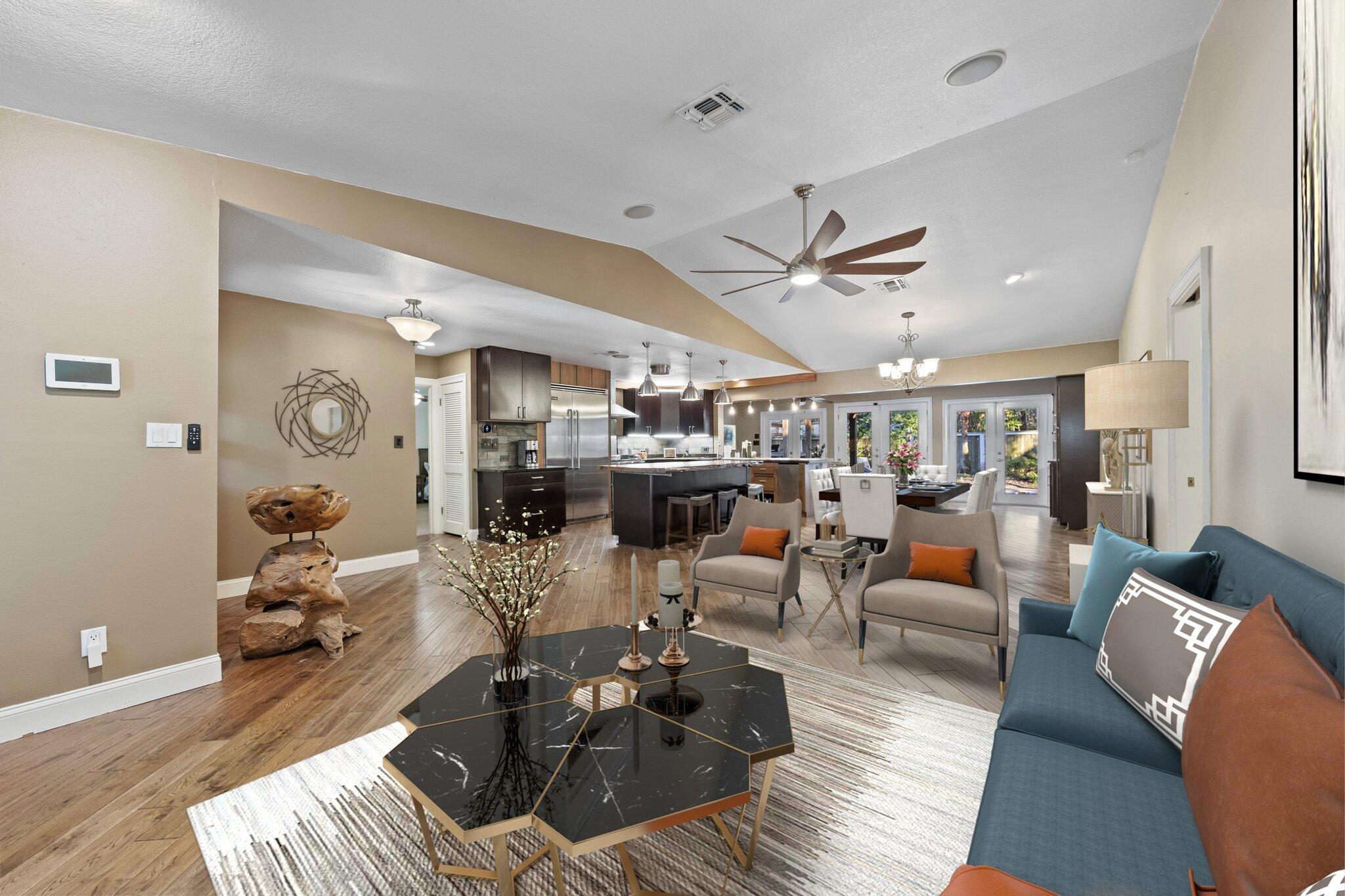 704 Main Street Destin, FL 32541 - Photo 11 of 59 a living room with furniture kitchen view and a large window