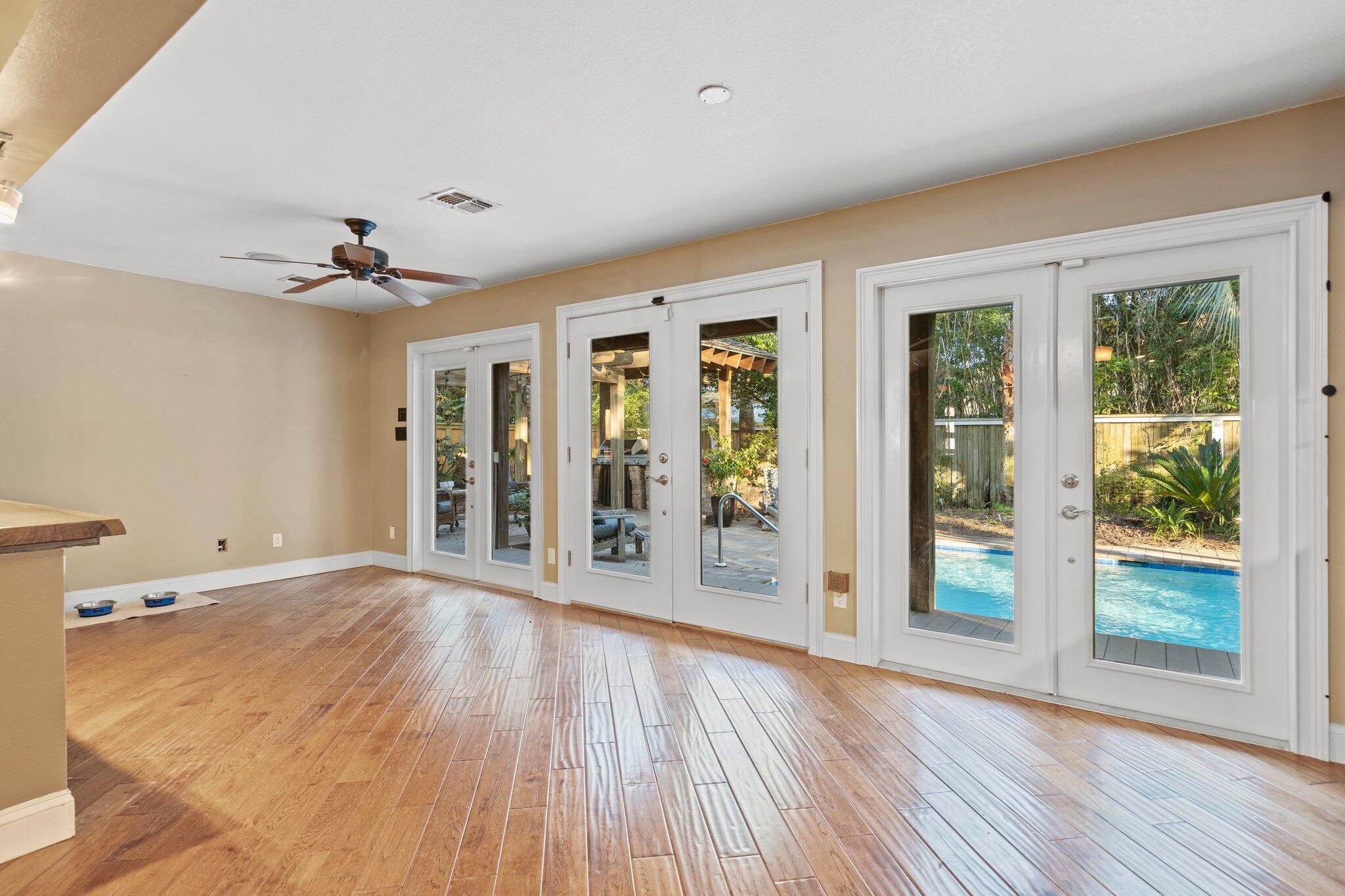 704 Main Street Destin, FL 32541 - Photo 15 of 59 wooden floor in an empty room with a window