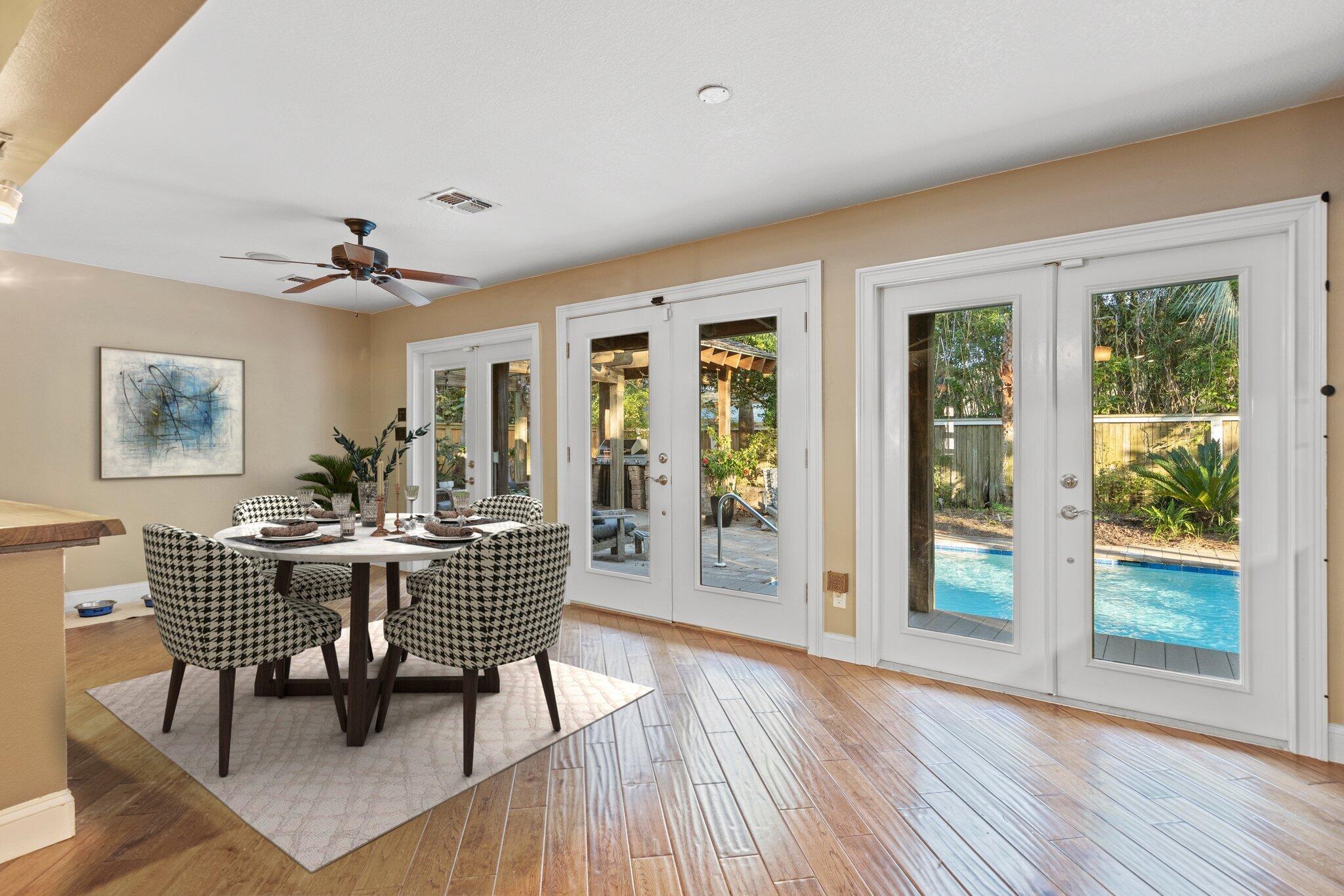 704 Main Street Destin, FL 32541 - Photo 16 of 59 a dining room with furniture window wooden floor