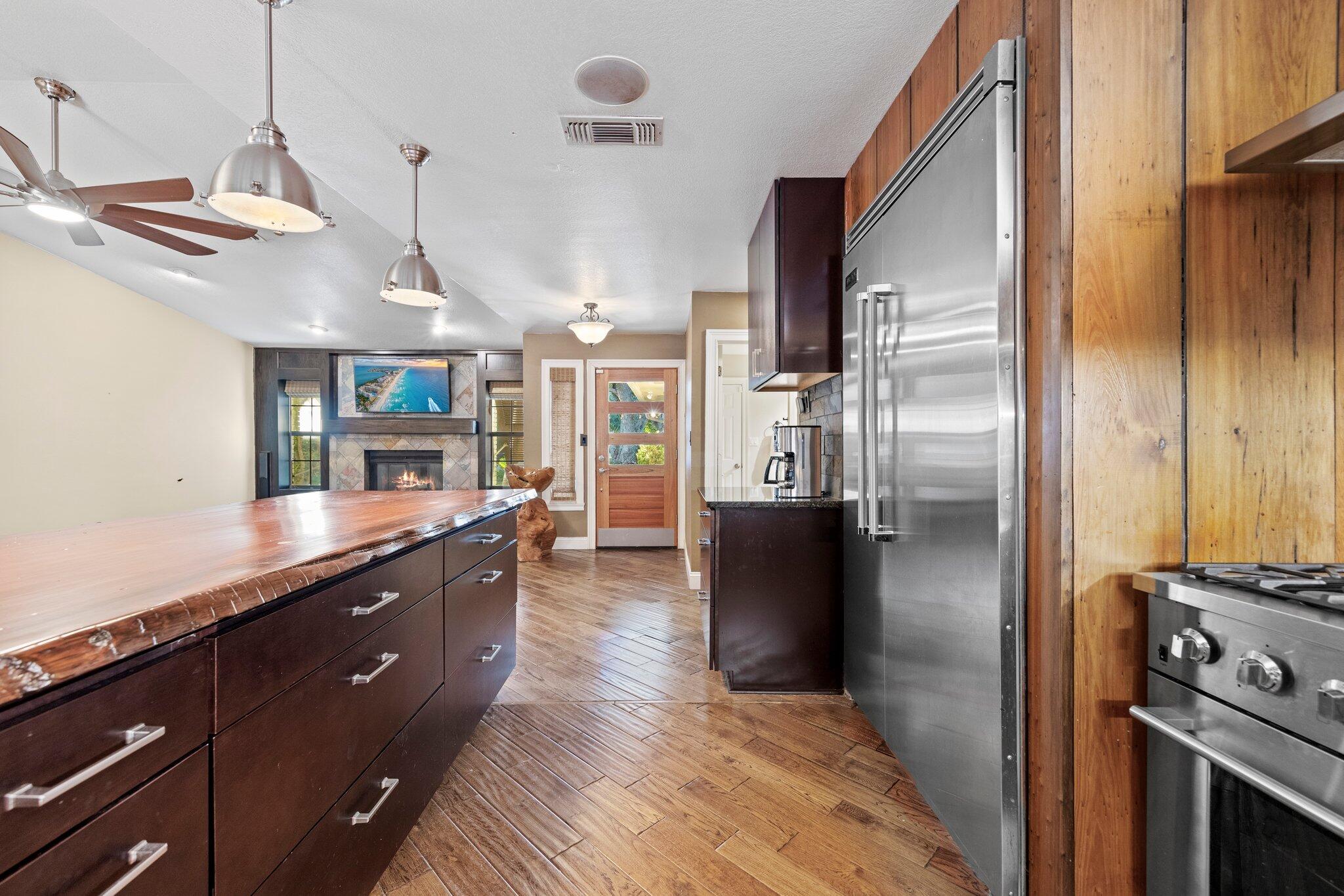 704 Main Street Destin, FL 32541 - Photo 19 of 59 a kitchen with stainless steel appliances granite countertop a refrigerator a sink and a stove
