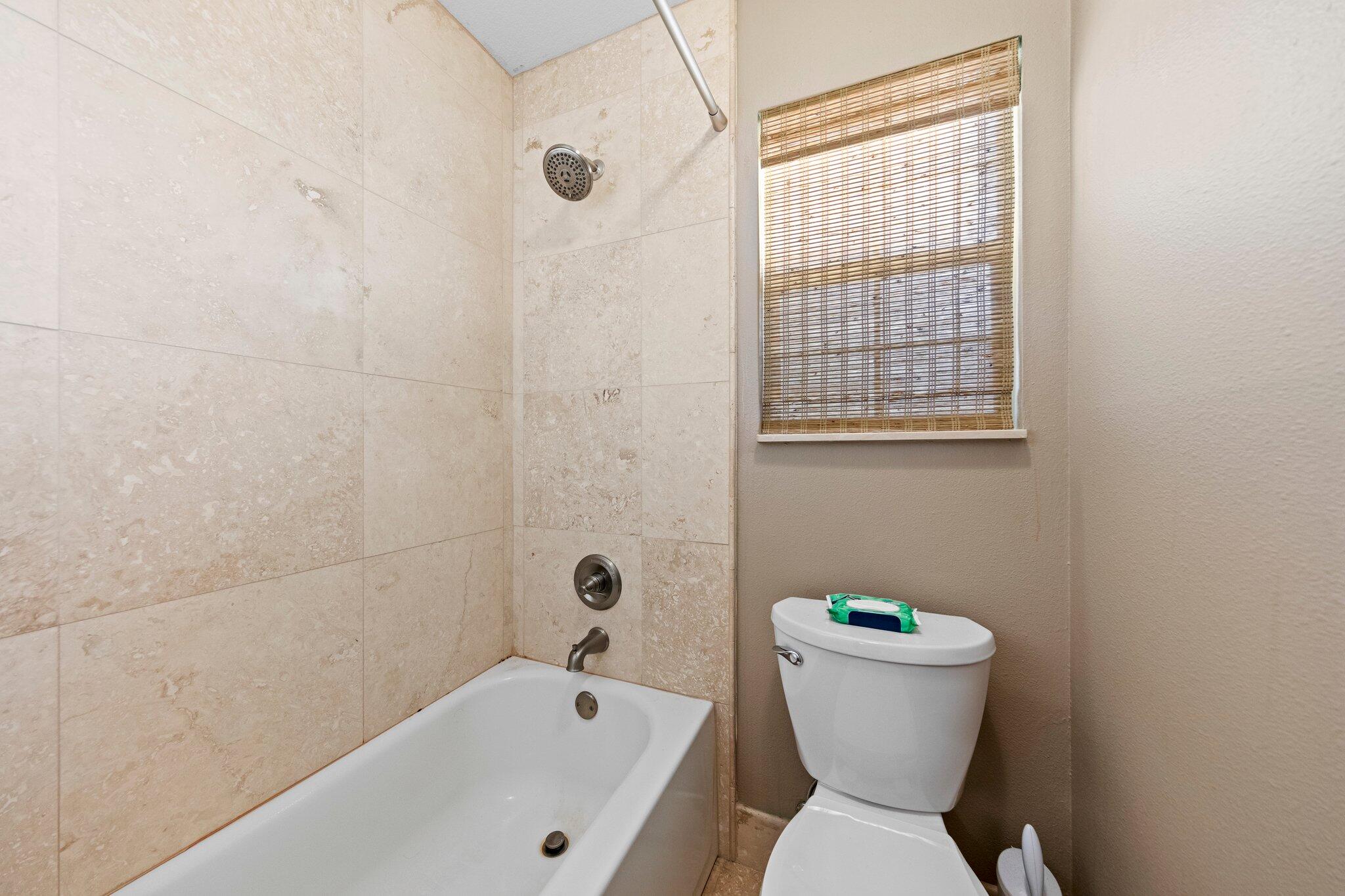 704 Main Street Destin, FL 32541 - Photo 30 of 59 a bathroom with a sink and a toilet