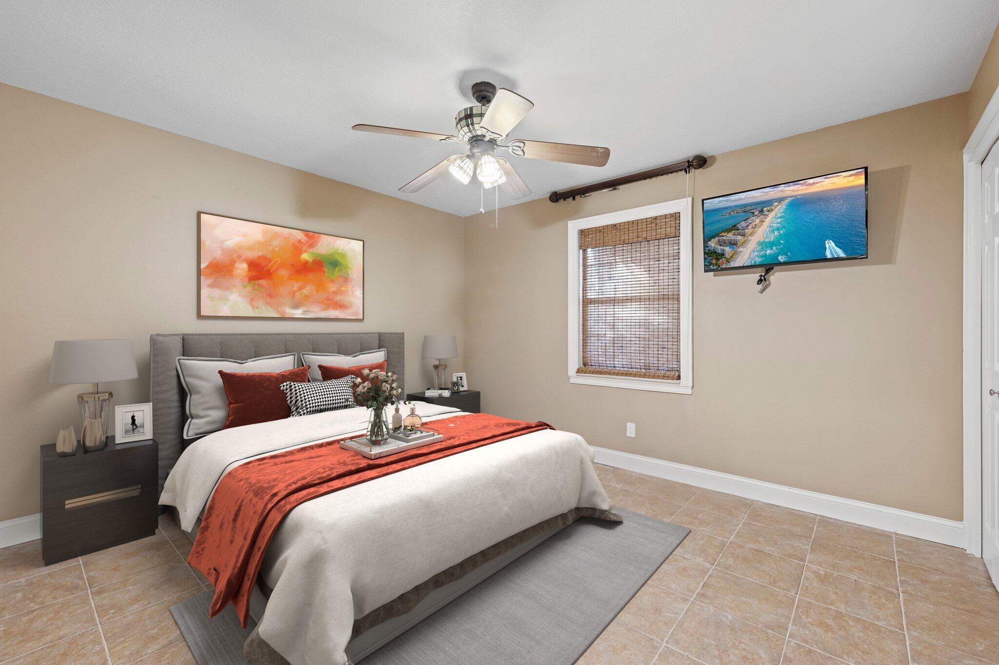 704 Main Street Destin, FL 32541 - Photo 31 of 59 a bedroom with a bed and a chandelier