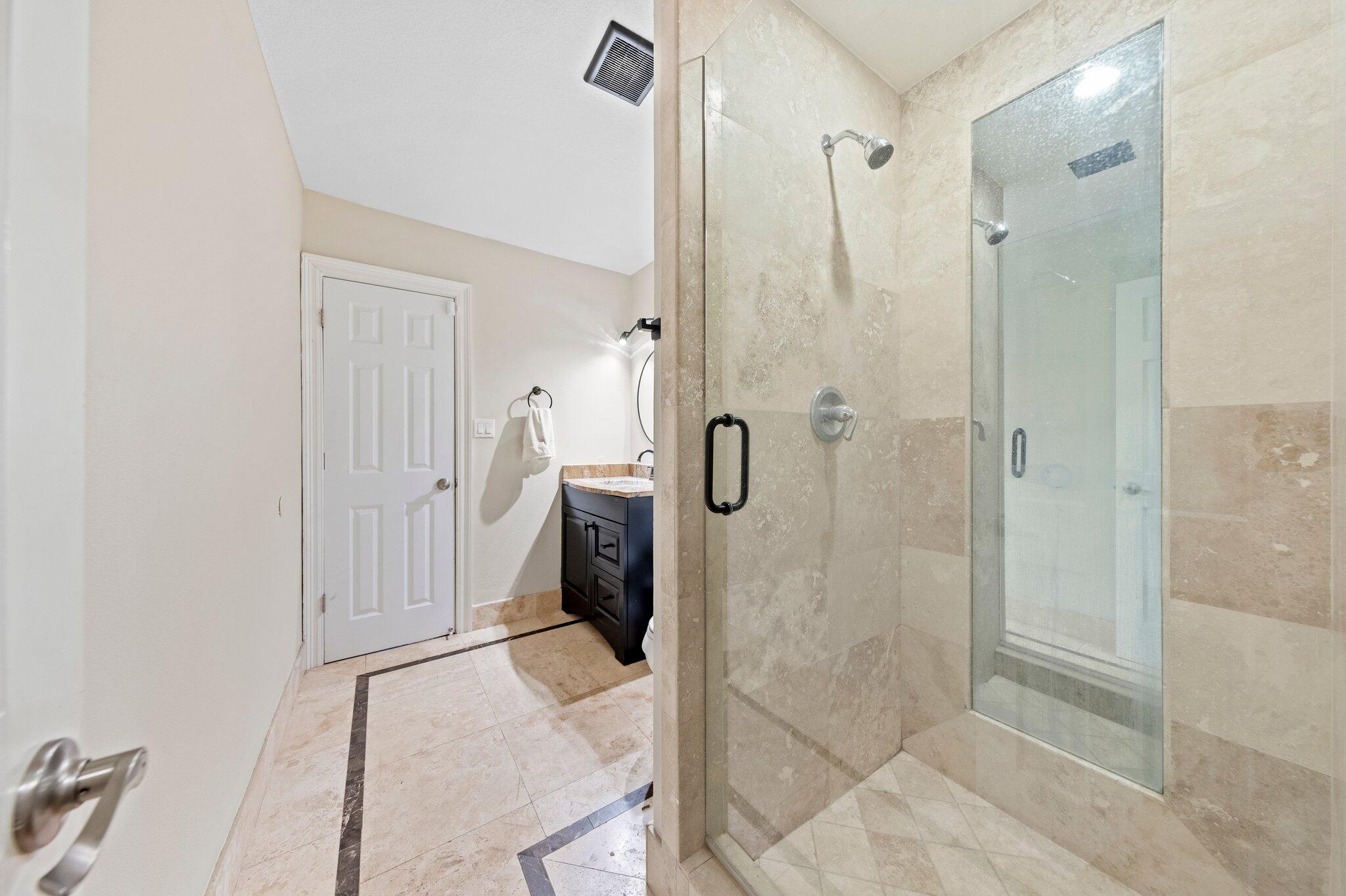 704 Main Street Destin, FL 32541 - Photo 32 of 59 a bathroom with a shower and toilet