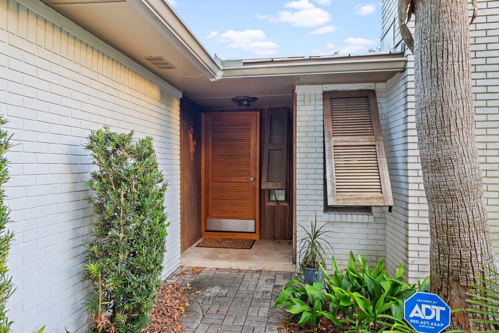 704 Main Street Destin, FL 32541 - Photo 50 of 59 a front view of a house with garden