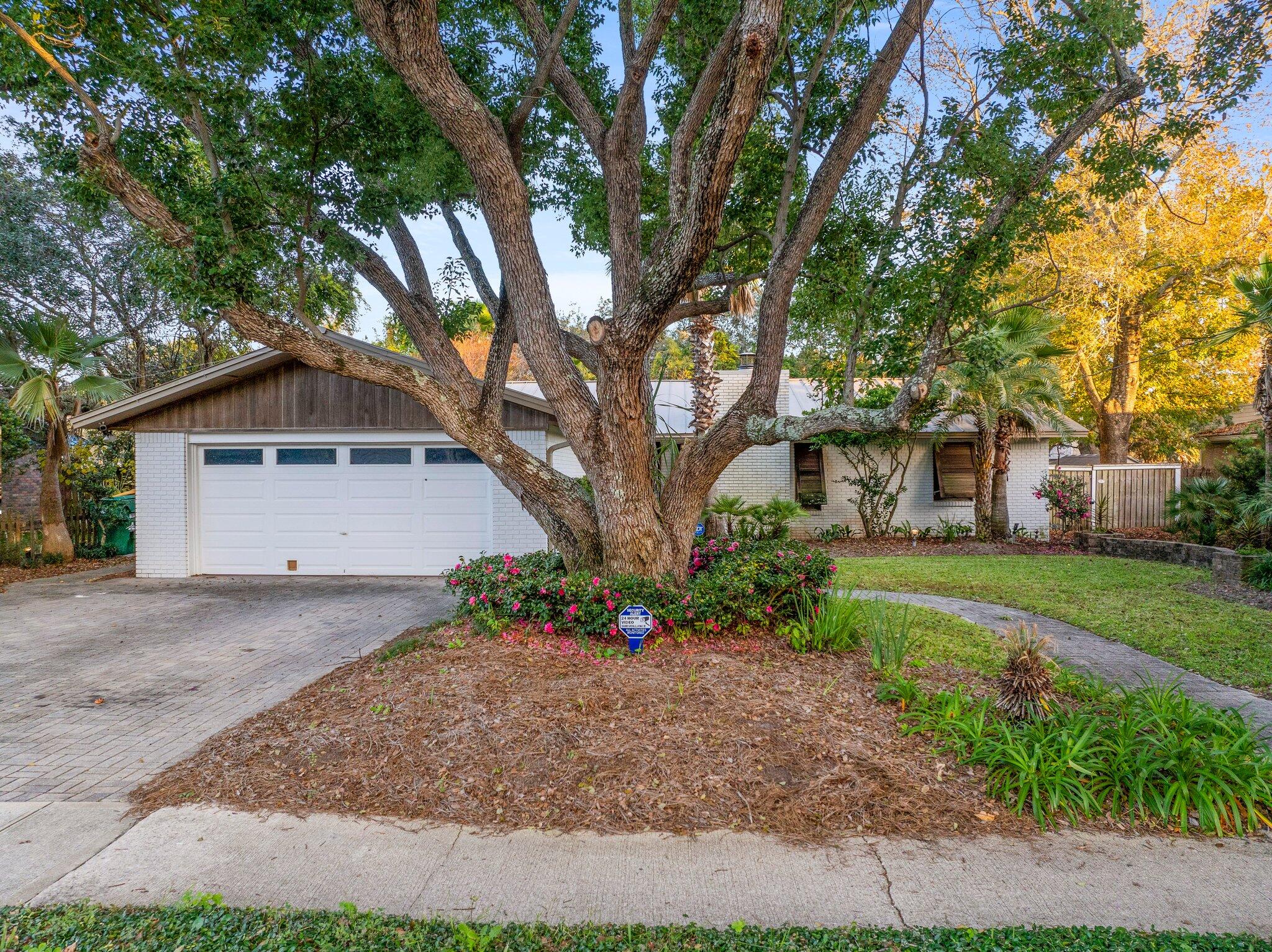 704 Main Street Destin, FL 32541 - Photo 55 of 59 a front view of a house with garden