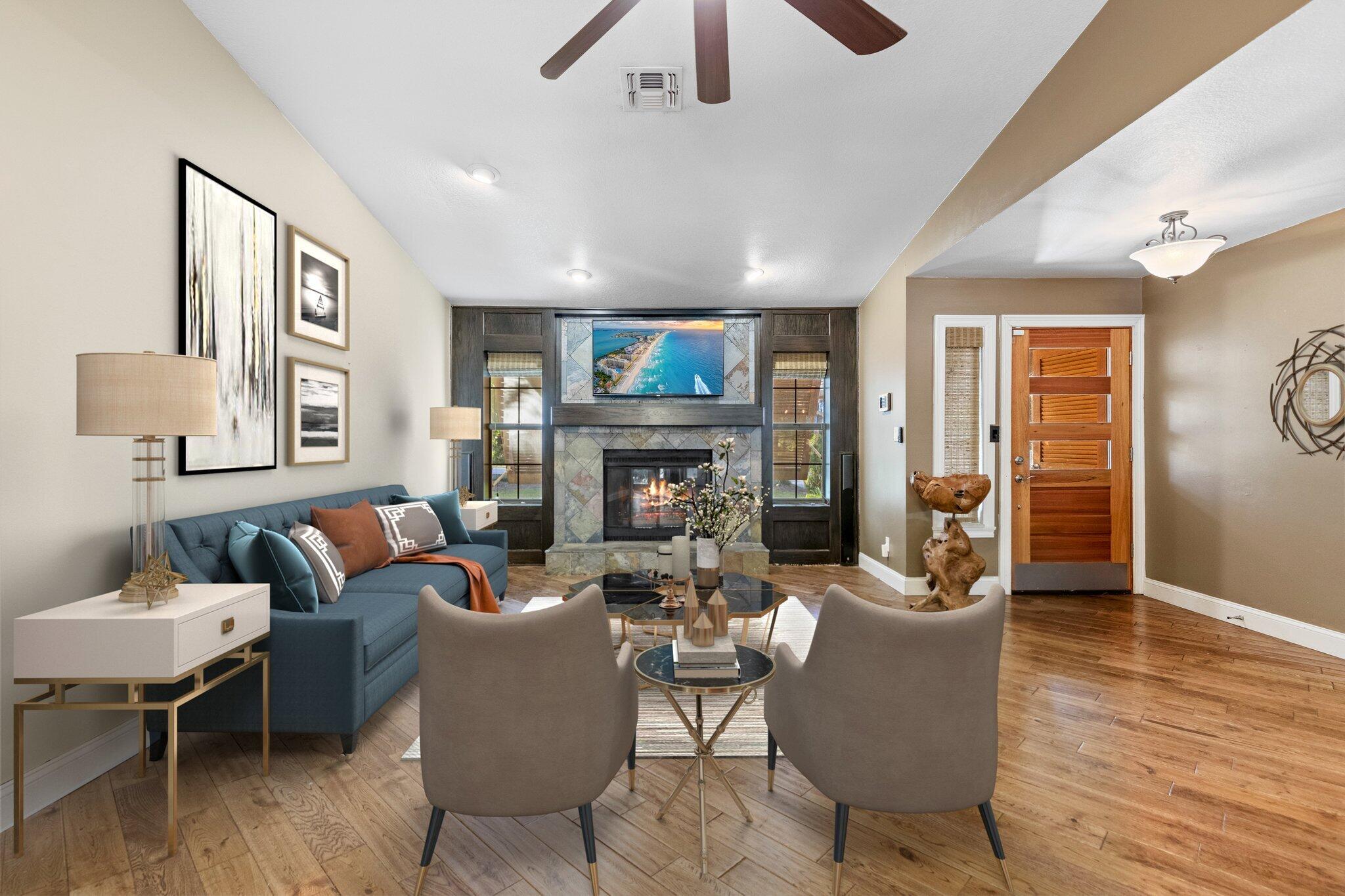 704 Main Street Destin, FL 32541 - Photo 10 of 59 a living room with furniture a fireplace and a flat screen tv