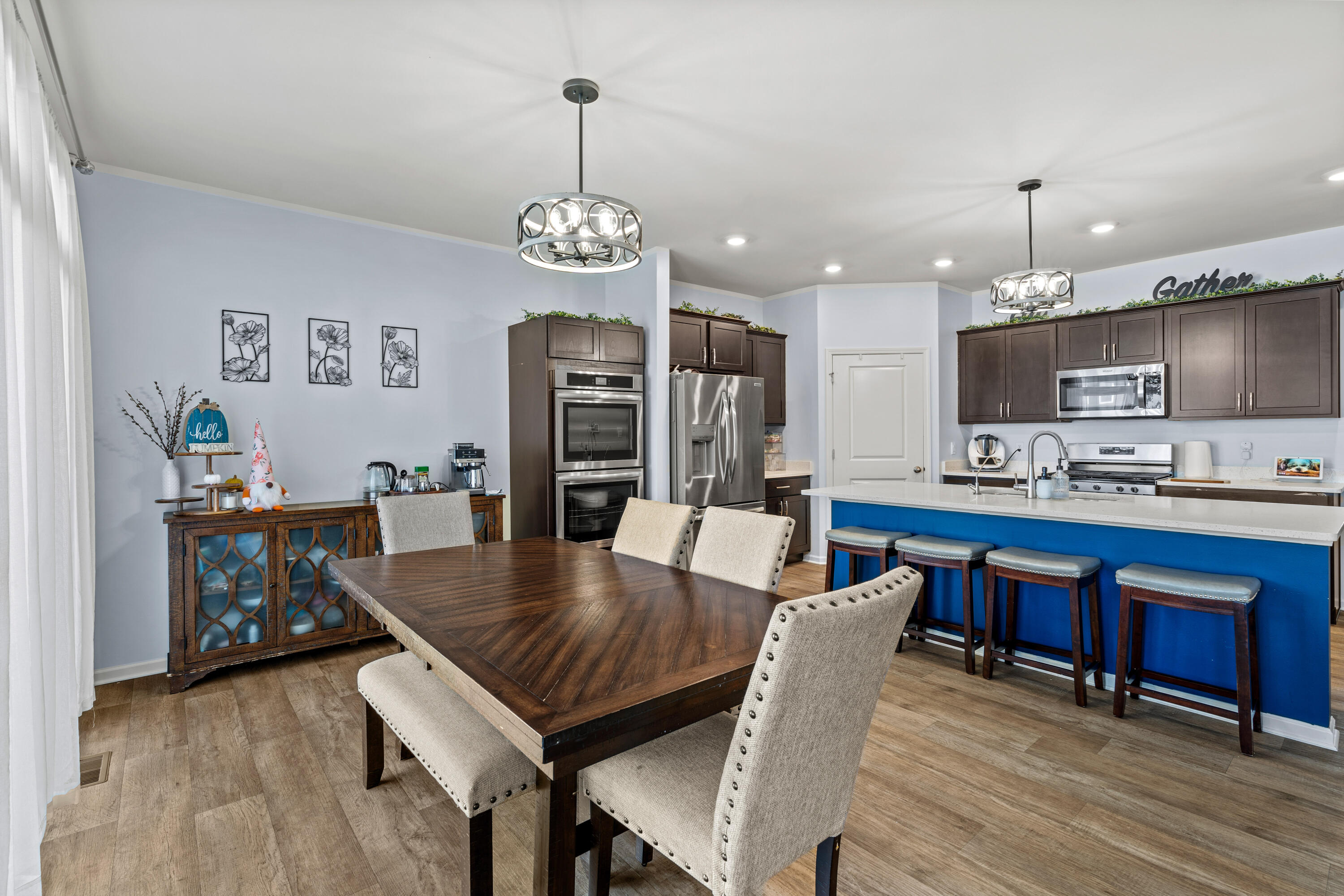 7620 West 105th Place Crown Point, IN 46307 - Photo 8 of 26 a view of kitchen and dining area with furniture