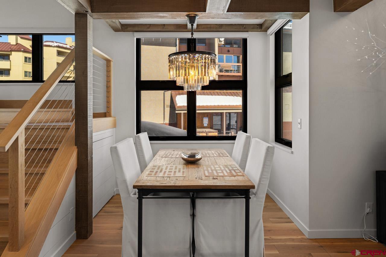14 Snowmass Road, Unit 308 Crested Butte, CO 81225 - Photo 15 of 40 a view of a dining room with furniture and window