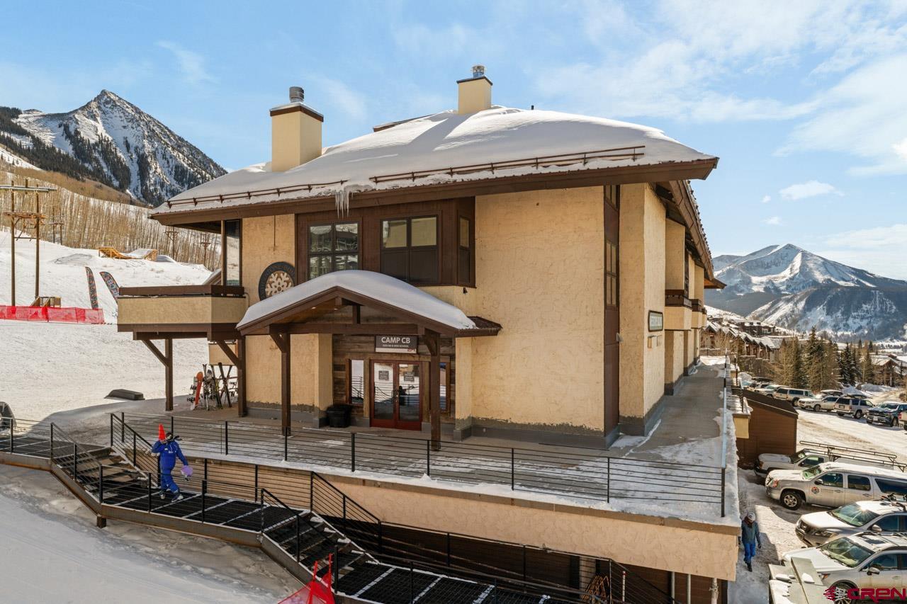 14 Snowmass Road, Unit 308 Crested Butte, CO 81225 - Photo 5 of 40 a front view of a house with parking area