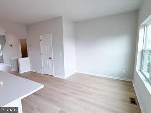 a view of a kitchen with a sink and cabinets