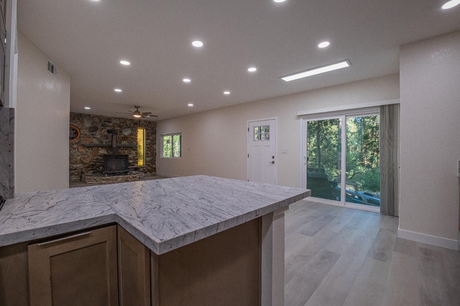 7701 Sly Park Road Placerville, CA 95667 - Photo 11 of 35 a kitchen with a sink and wooden floor