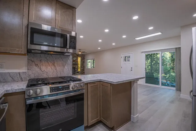a kitchen with a stove and a sink