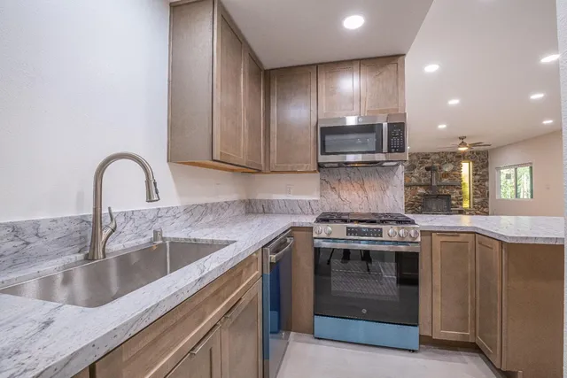 a view of kitchen with furniture and a table