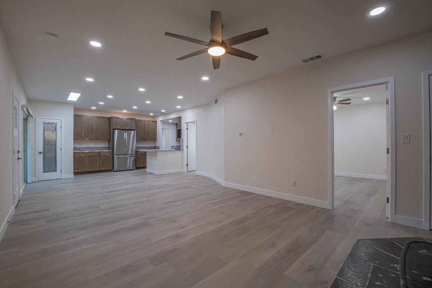 7701 Sly Park Road Placerville, CA 95667 - Photo 16 of 35 a view of an empty room with a ceiling fan