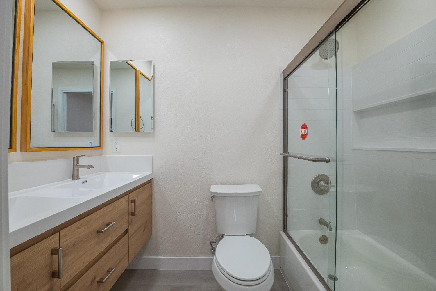 7701 Sly Park Road Placerville, CA 95667 - Photo 21 of 35 a bathroom with a toilet sink a mirror and shower