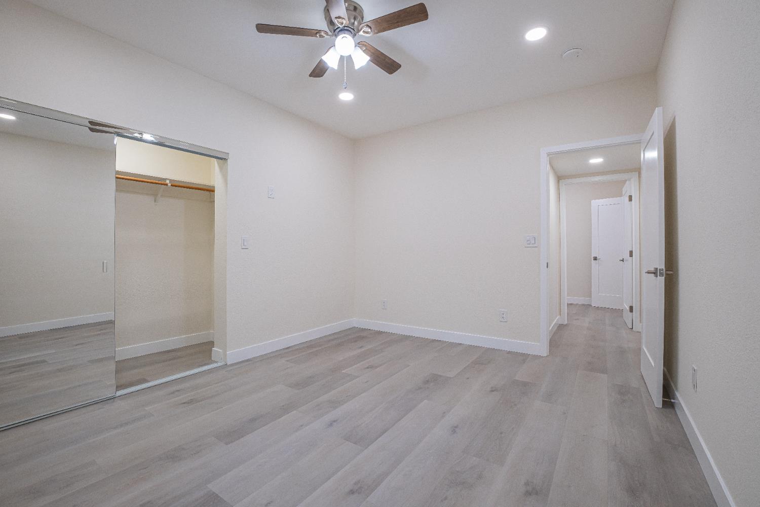 7701 Sly Park Road Placerville, CA 95667 - Photo 27 of 35 a view of an empty room with wooden floor