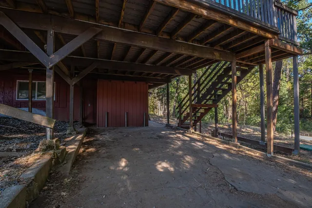 a view of kitchen with refrigerator microwave and wooden floor