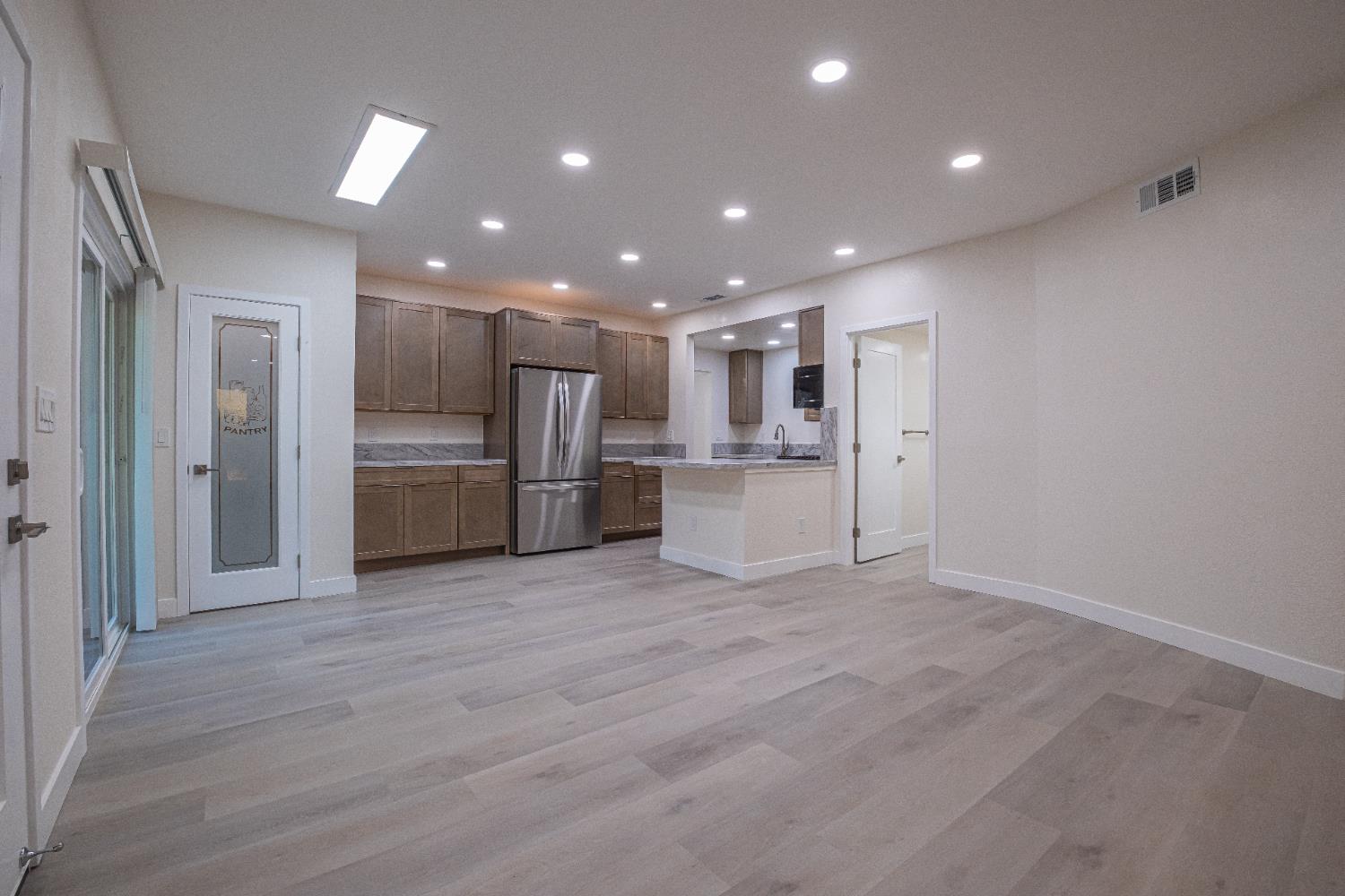 7701 Sly Park Road Placerville, CA 95667 - Photo 6 of 35 a view of kitchen with refrigerator and microwave