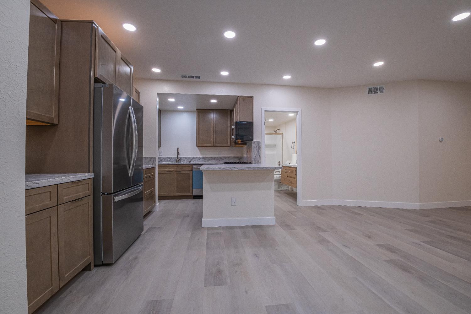 7701 Sly Park Road Placerville, CA 95667 - Photo 7 of 35 a kitchen with a refrigerator and a sink