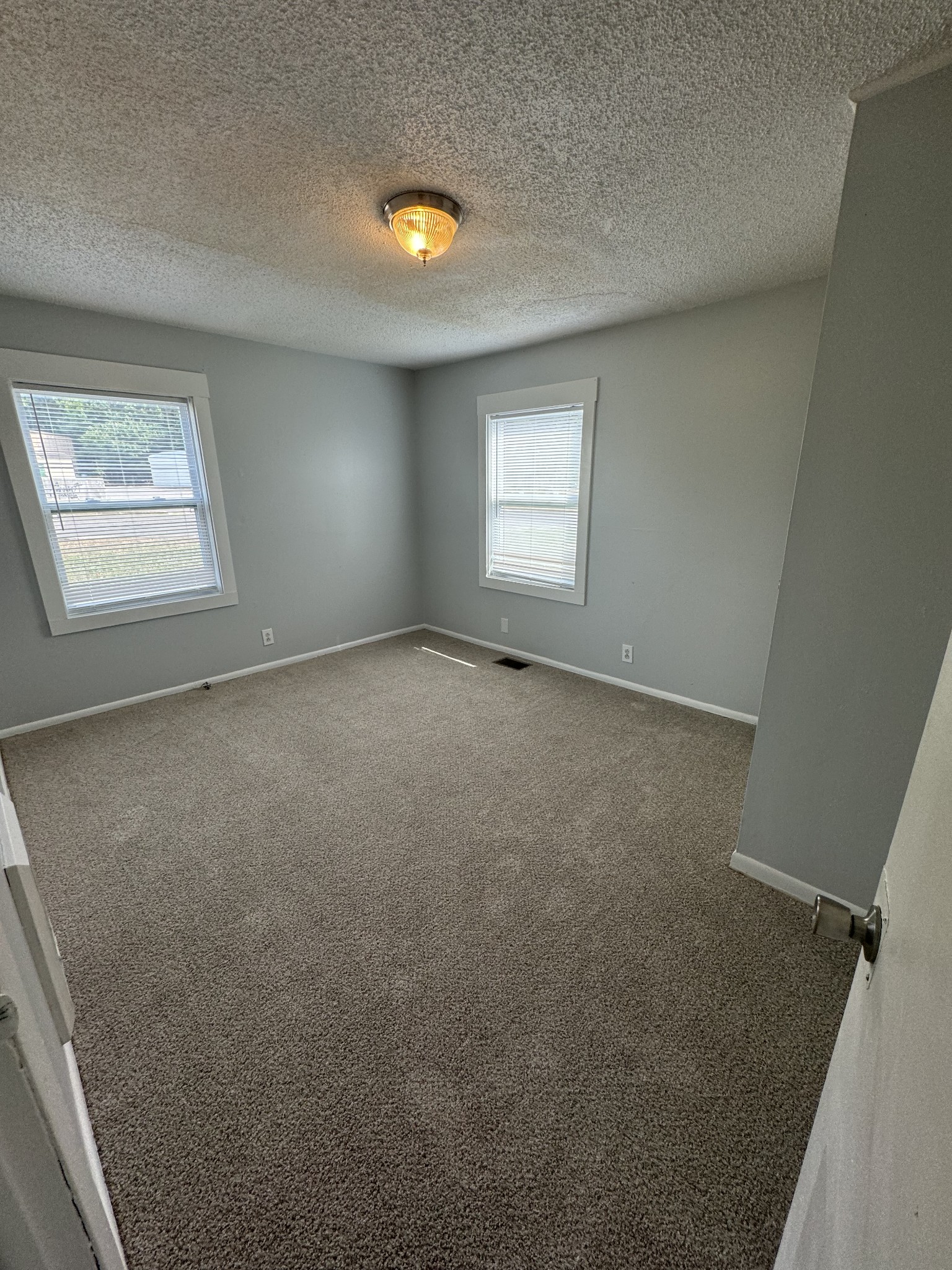 1104 Riverside Drive Murfreesboro, TN 37129 - Photo 8 of 8 an empty room with windows
