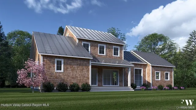 a front view of a house with a garden