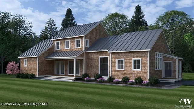 a front view of a house with a garden