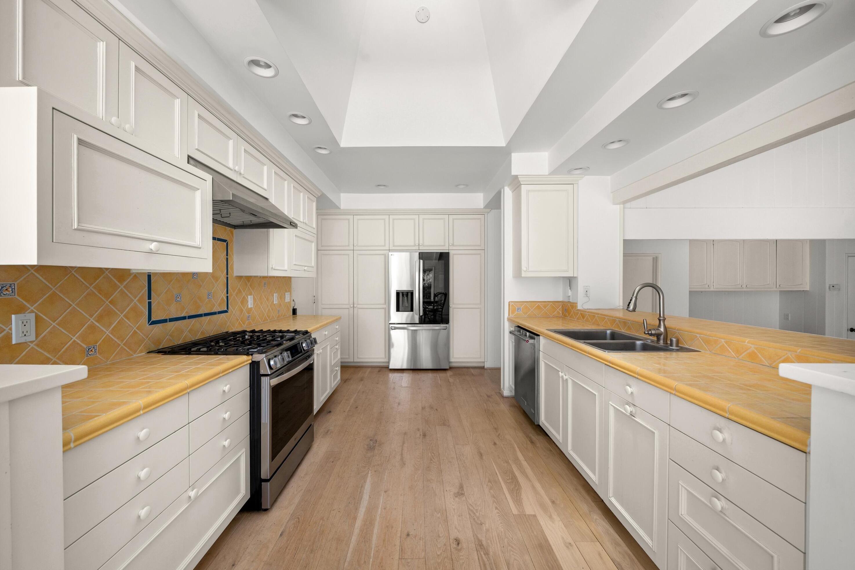 166 Rancho Alisal Drive Solvang, CA 93463 - Photo 9 of 24 a large kitchen with stainless steel appliances granite countertop a stove and a sink