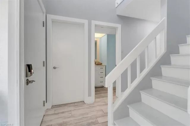a bedroom with a large bed and a ceiling fan