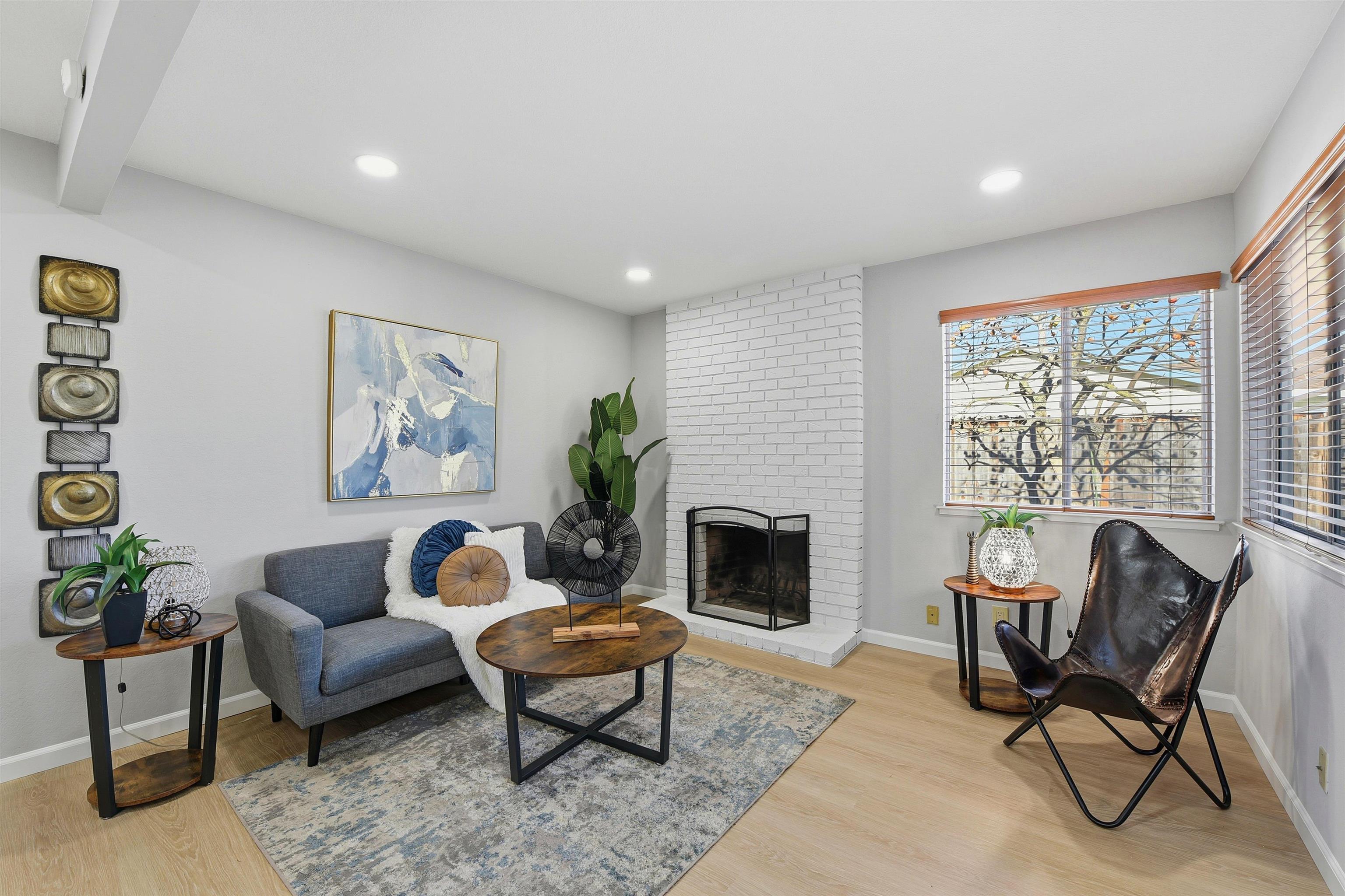 37768 Rockspray Street Newark, CA 94560 - Photo 15 of 34 a living room with furniture and a fireplace