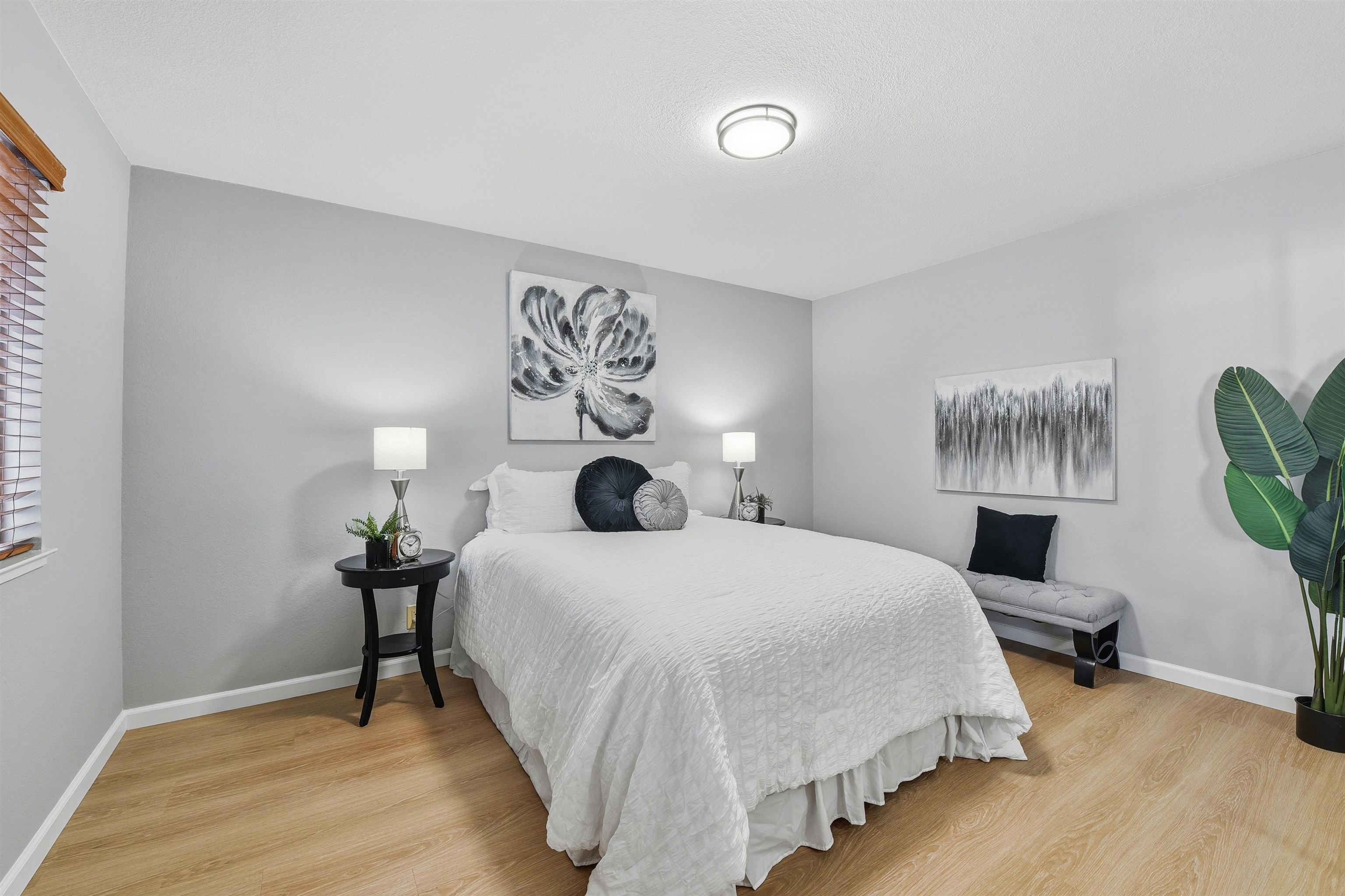 37768 Rockspray Street Newark, CA 94560 - Photo 19 of 34 a bedroom with a bed a table and chair