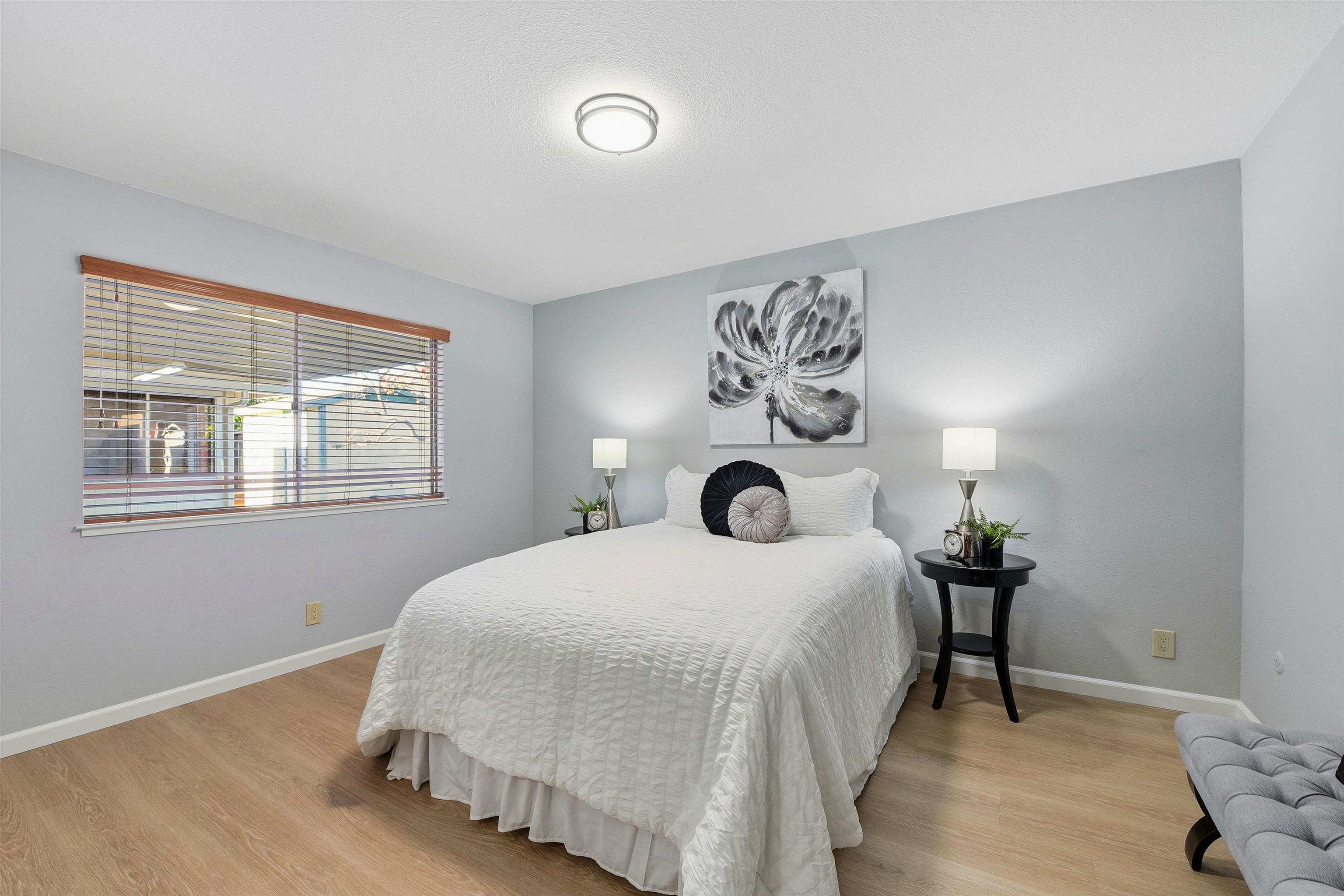 37768 Rockspray Street Newark, CA 94560 - Photo 20 of 34 a bedroom with a bed and wooden floor