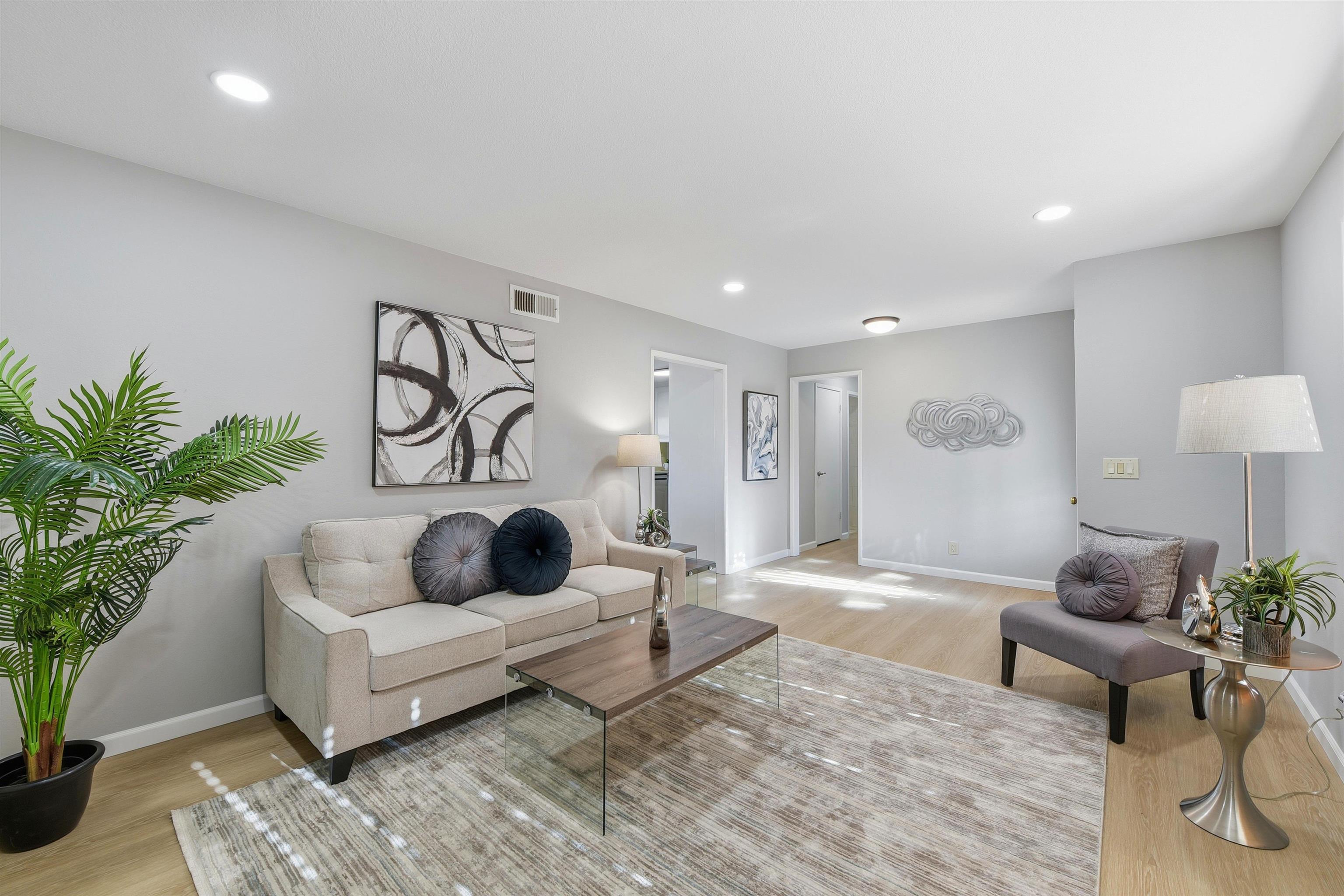 37768 Rockspray Street Newark, CA 94560 - Photo 2 of 34 a living room with furniture and a potted plant