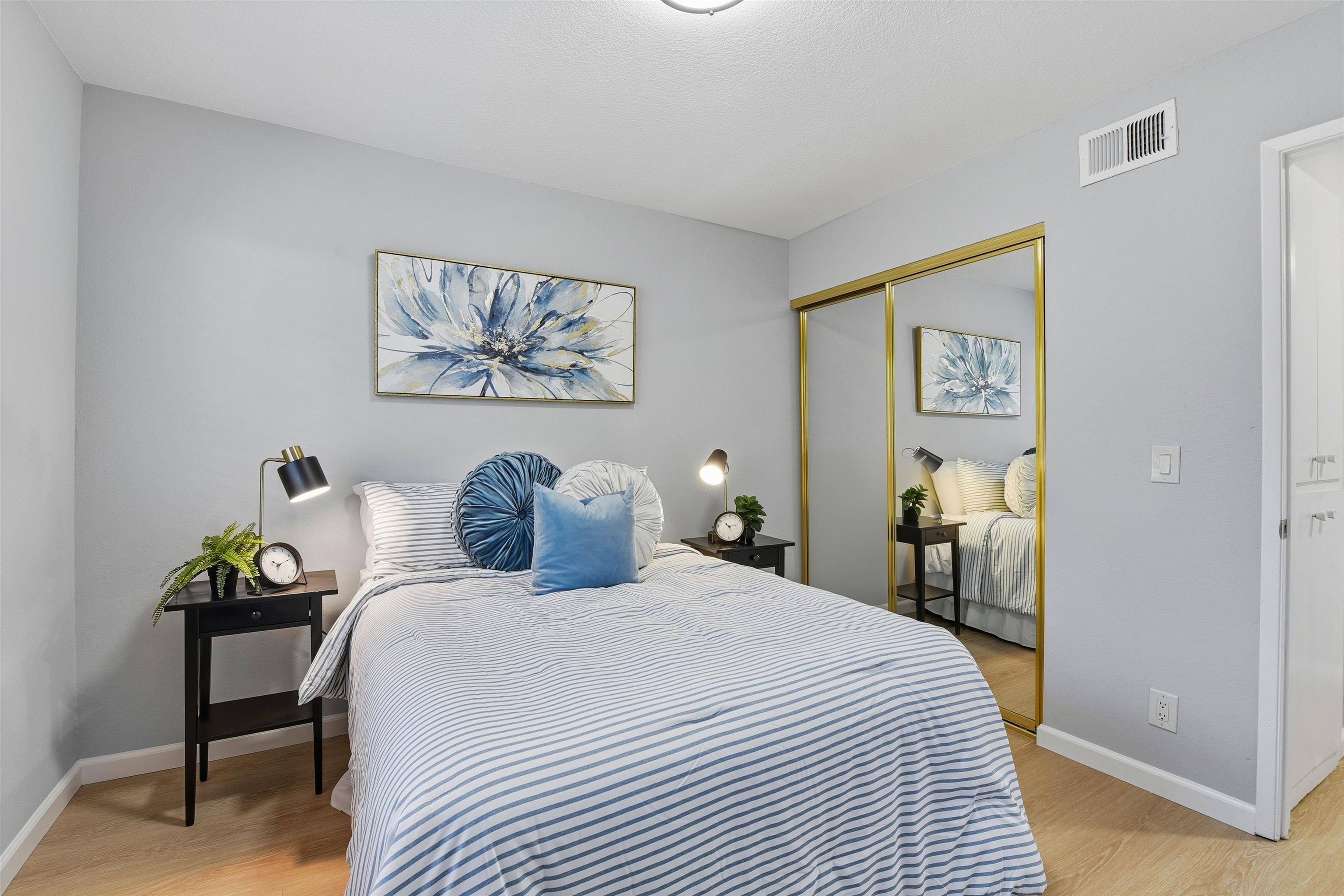 37768 Rockspray Street Newark, CA 94560 - Photo 26 of 34 a bedroom with a bed and a table