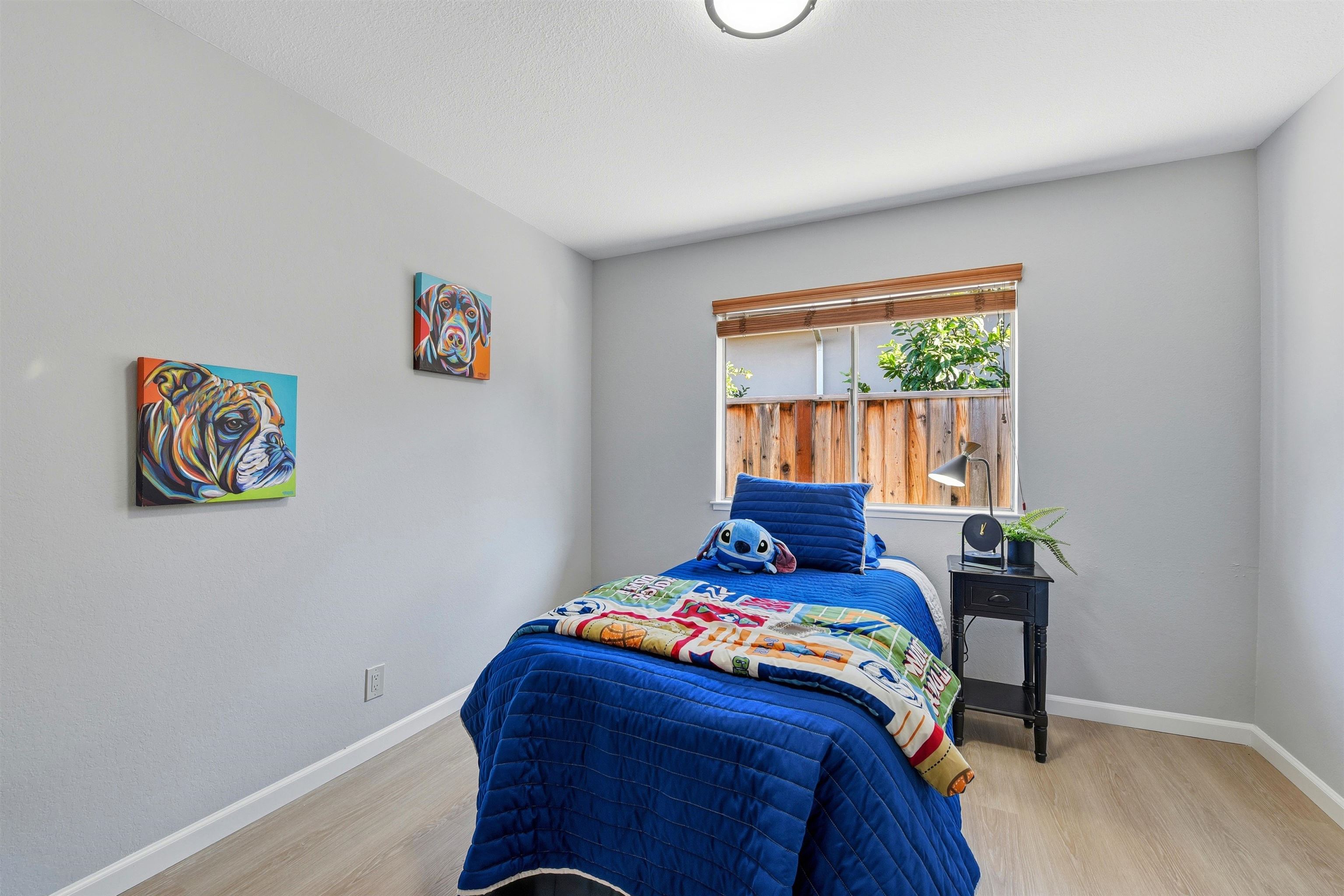 37768 Rockspray Street Newark, CA 94560 - Photo 27 of 34 a bed sitting in a bedroom next to a window