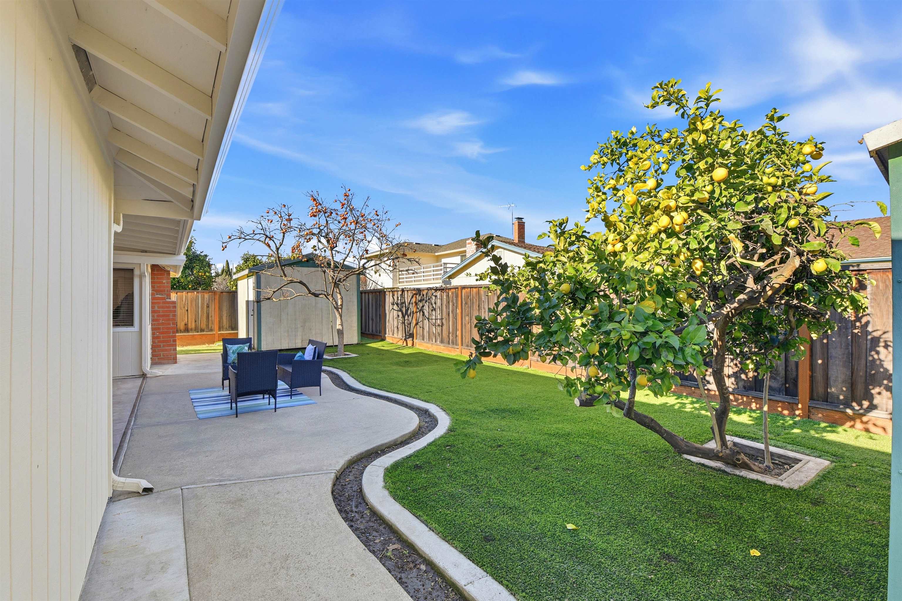 37768 Rockspray Street Newark, CA 94560 - Photo 32 of 34 a view of a patio with couches table and chairs and potted plants