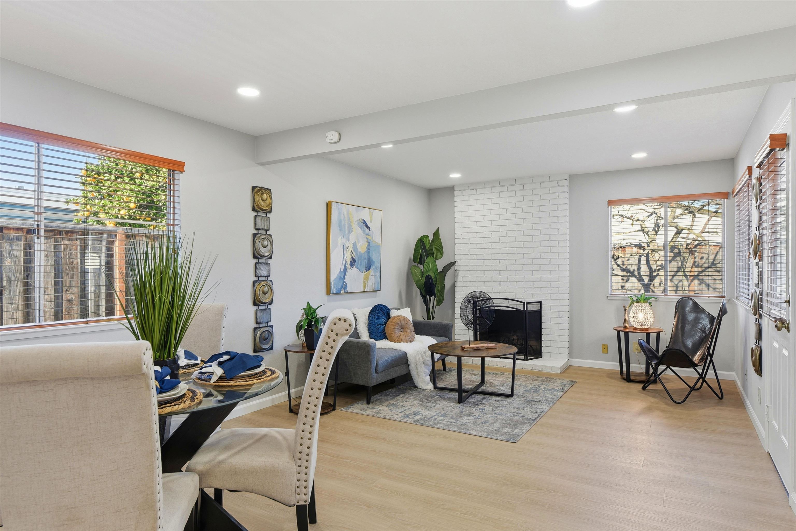 37768 Rockspray Street Newark, CA 94560 - Photo 6 of 34 a living room with furniture floor to ceiling window and potted plant