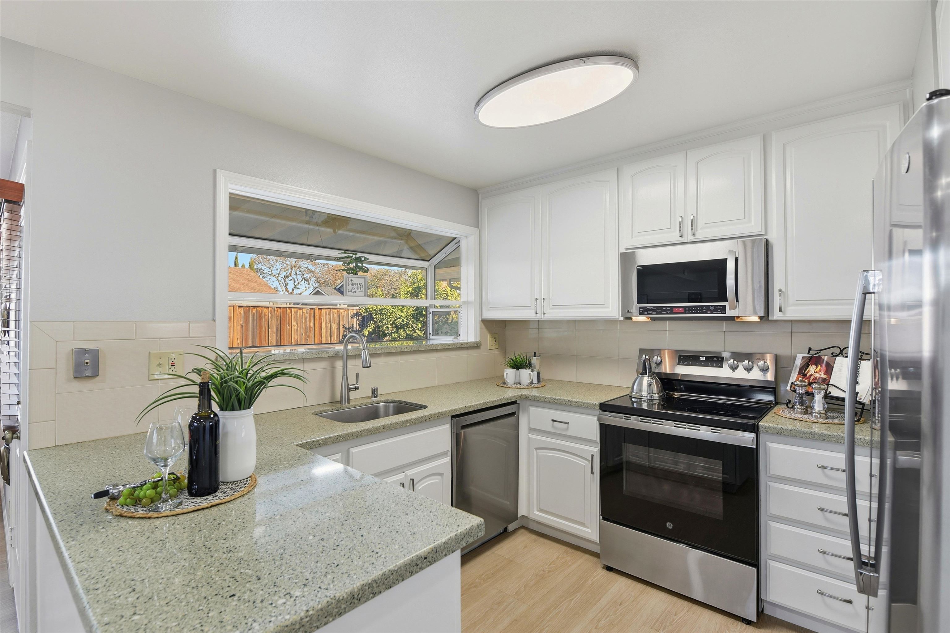 37768 Rockspray Street Newark, CA 94560 - Photo 8 of 34 a kitchen with stainless steel appliances granite countertop a sink and a stove
