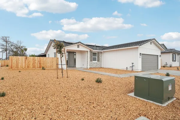a house view with a backyard space