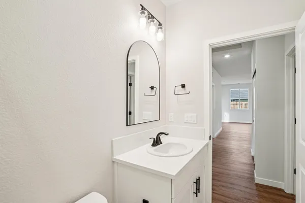 a view of a hallway with a white walls