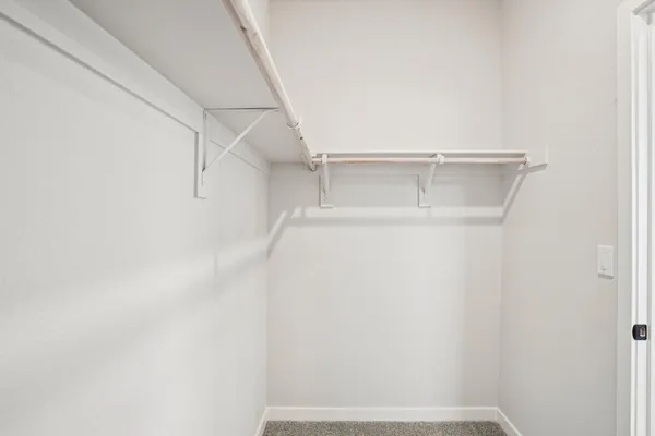 a bathroom with mirror a sink and vanity