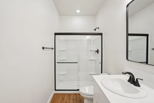 a bathroom with double vanity sink and mirror