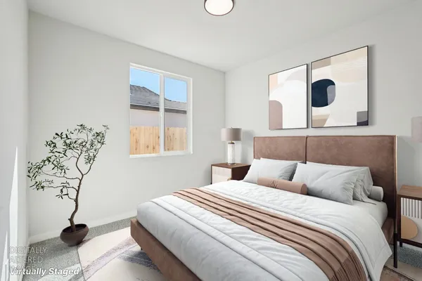 a bedroom with a bed and window