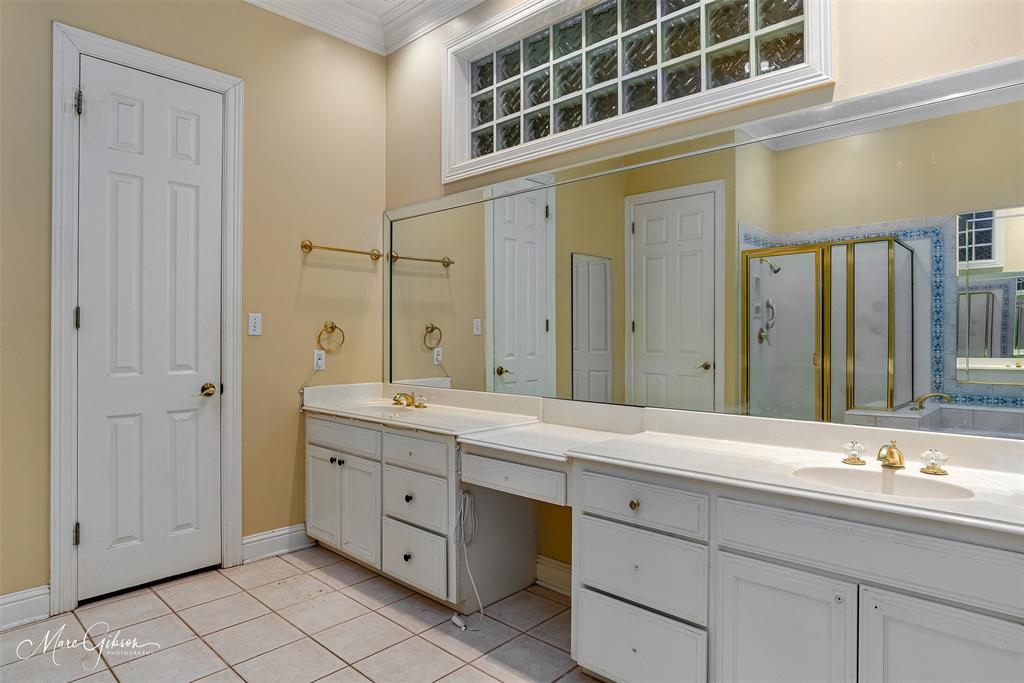 330 Pierremont Road, Unit 1 Shreveport, LA 71106 - Photo 12 of 21 a bathroom with a double vanity sink and a mirror