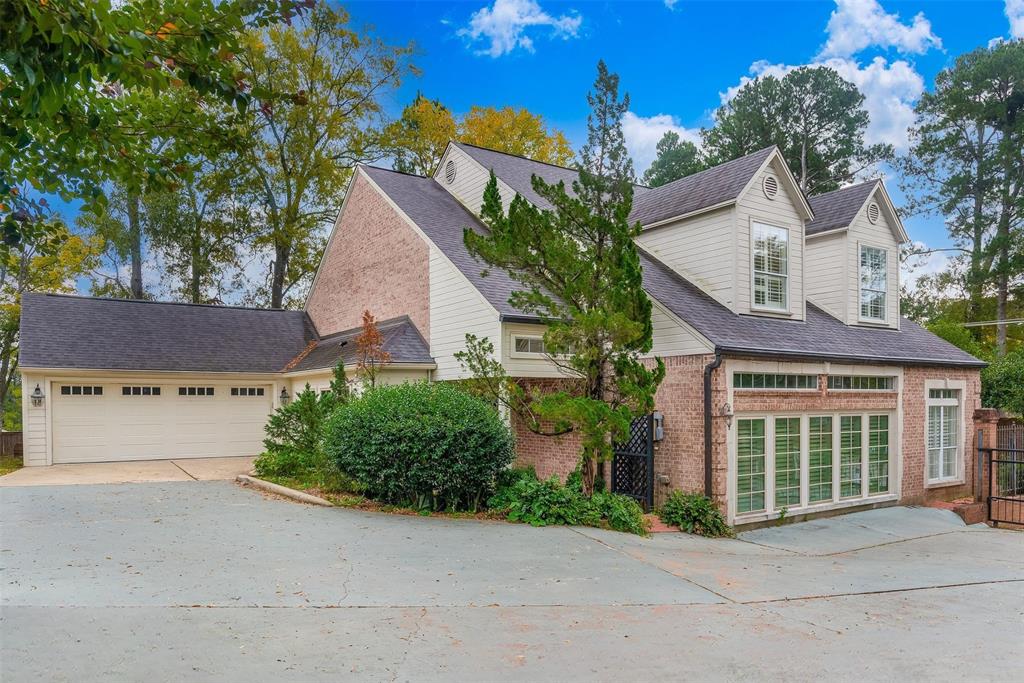 330 Pierremont Road, Unit 1 Shreveport, LA 71106 - Photo 3 of 21 front view of a house with a small yard