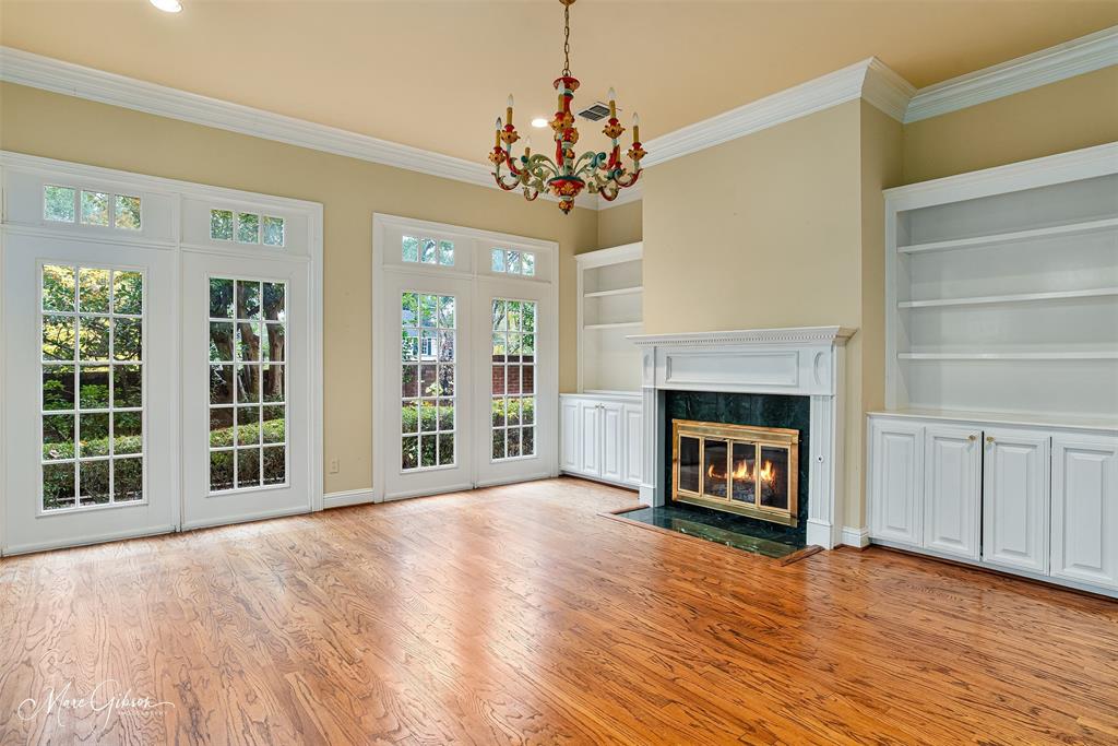 330 Pierremont Road, Unit 1 Shreveport, LA 71106 - Photo 5 of 21 a view of a livingroom with a fireplace wooden floor and windows