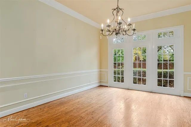 a kitchen with granite countertop white cabinets and a sink