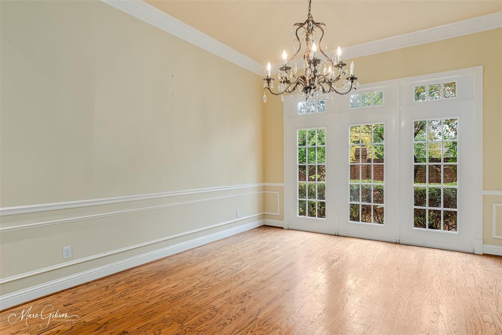 330 Pierremont Road, Unit 1 Shreveport, LA 71106 - Photo 6 of 21 a view of an empty room with window and chandelier fan