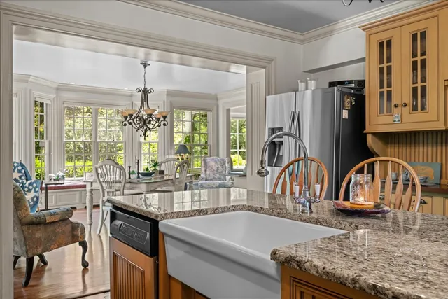 a kitchen with sink refrigerator and window